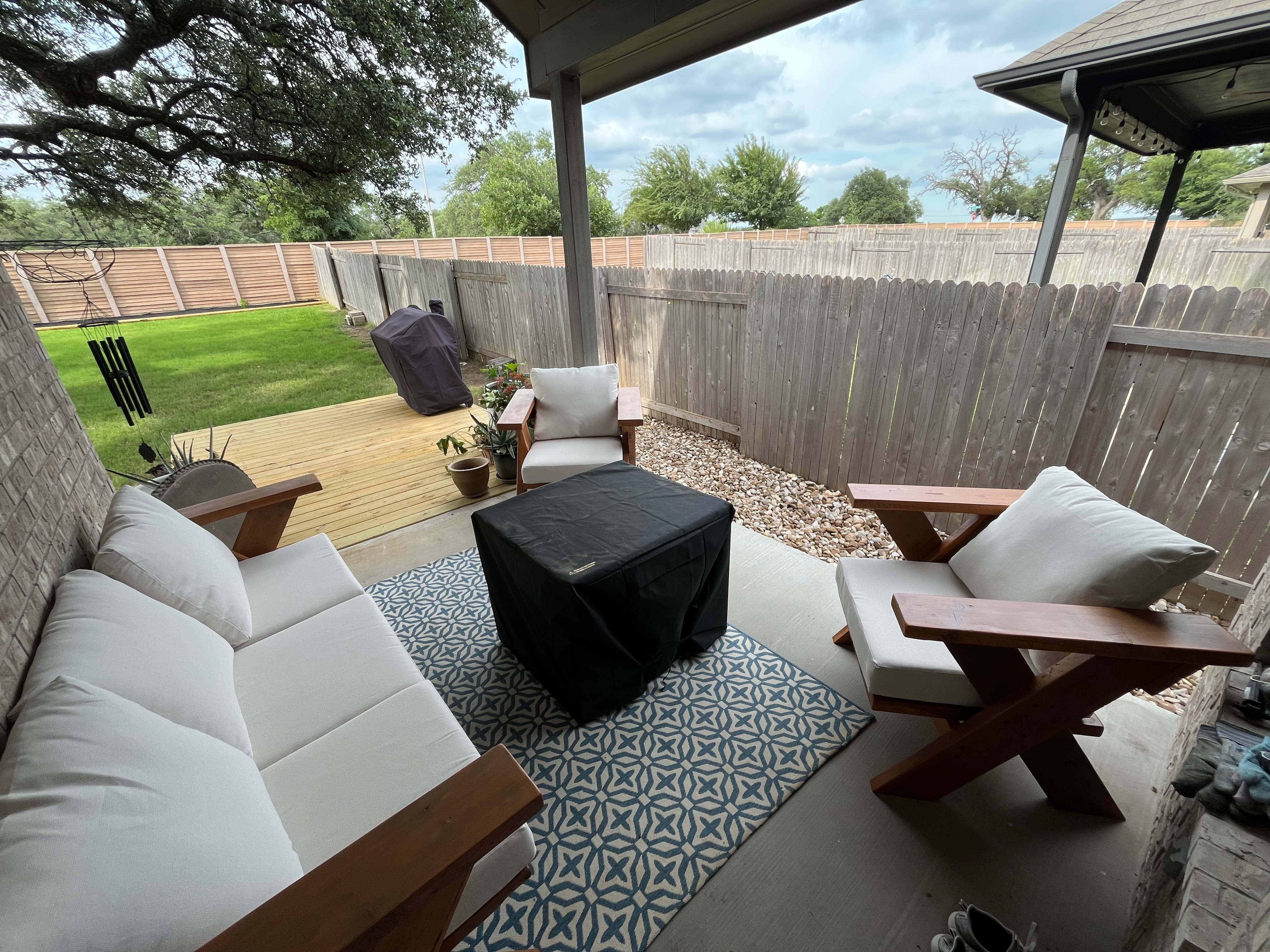 Custom outdoor living space with deck and furniture
