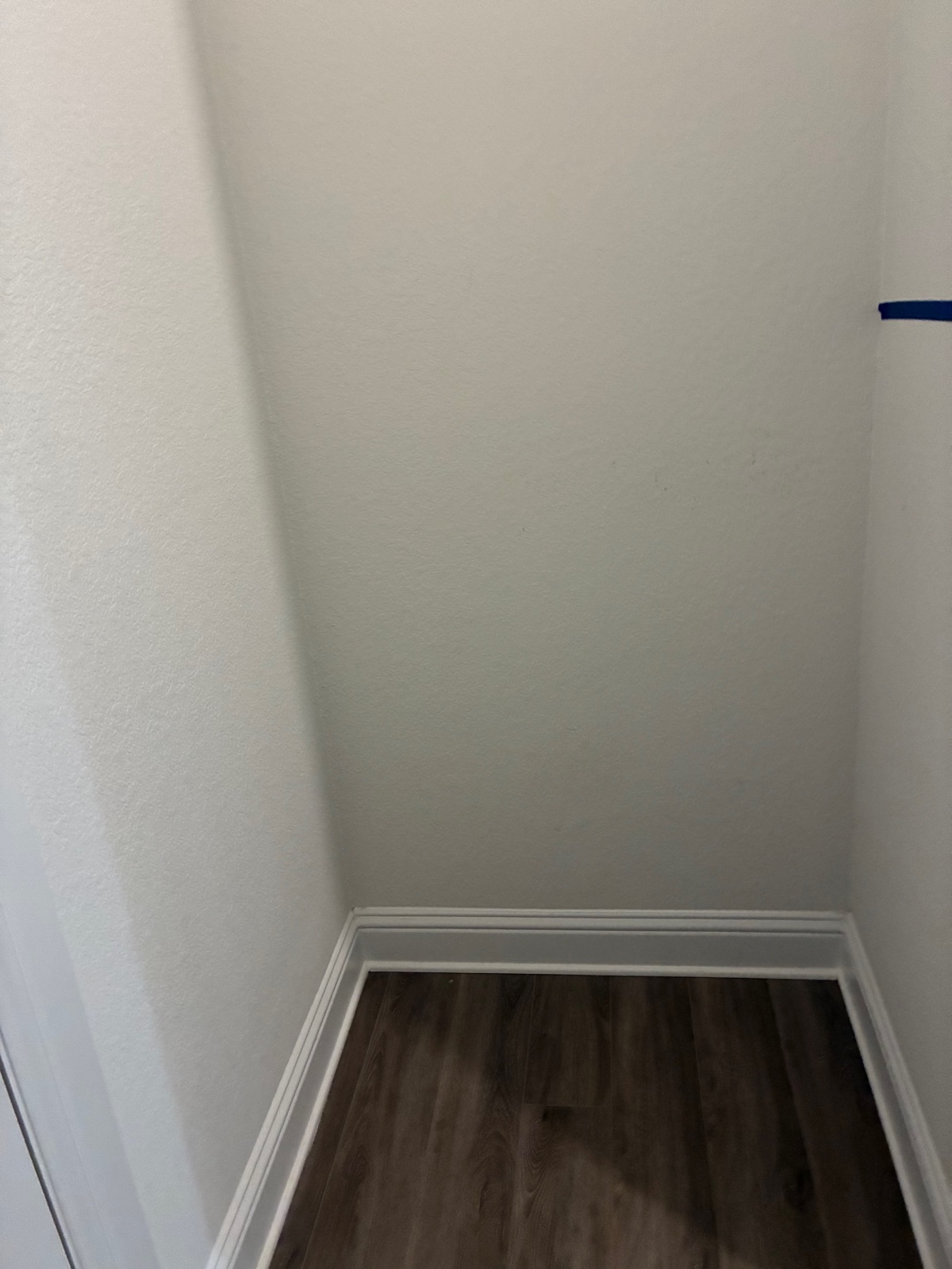 Empty entryway nook before the custom shoe storage build